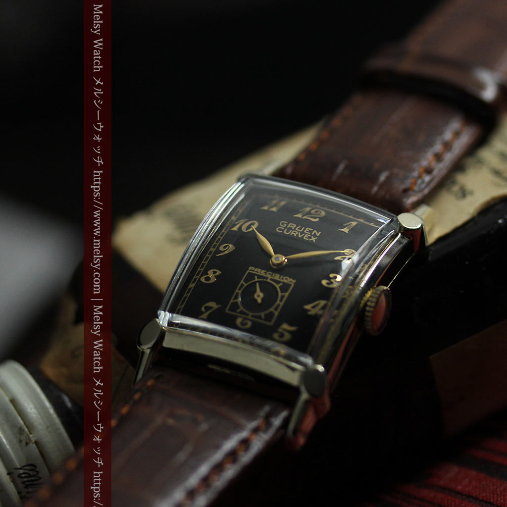 カーベックス 形の特殊な黒&金のグリュエンのアンティーク腕時計